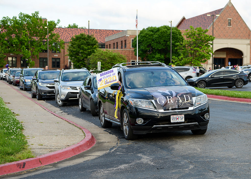 Friends and family line up their decorated vehicles